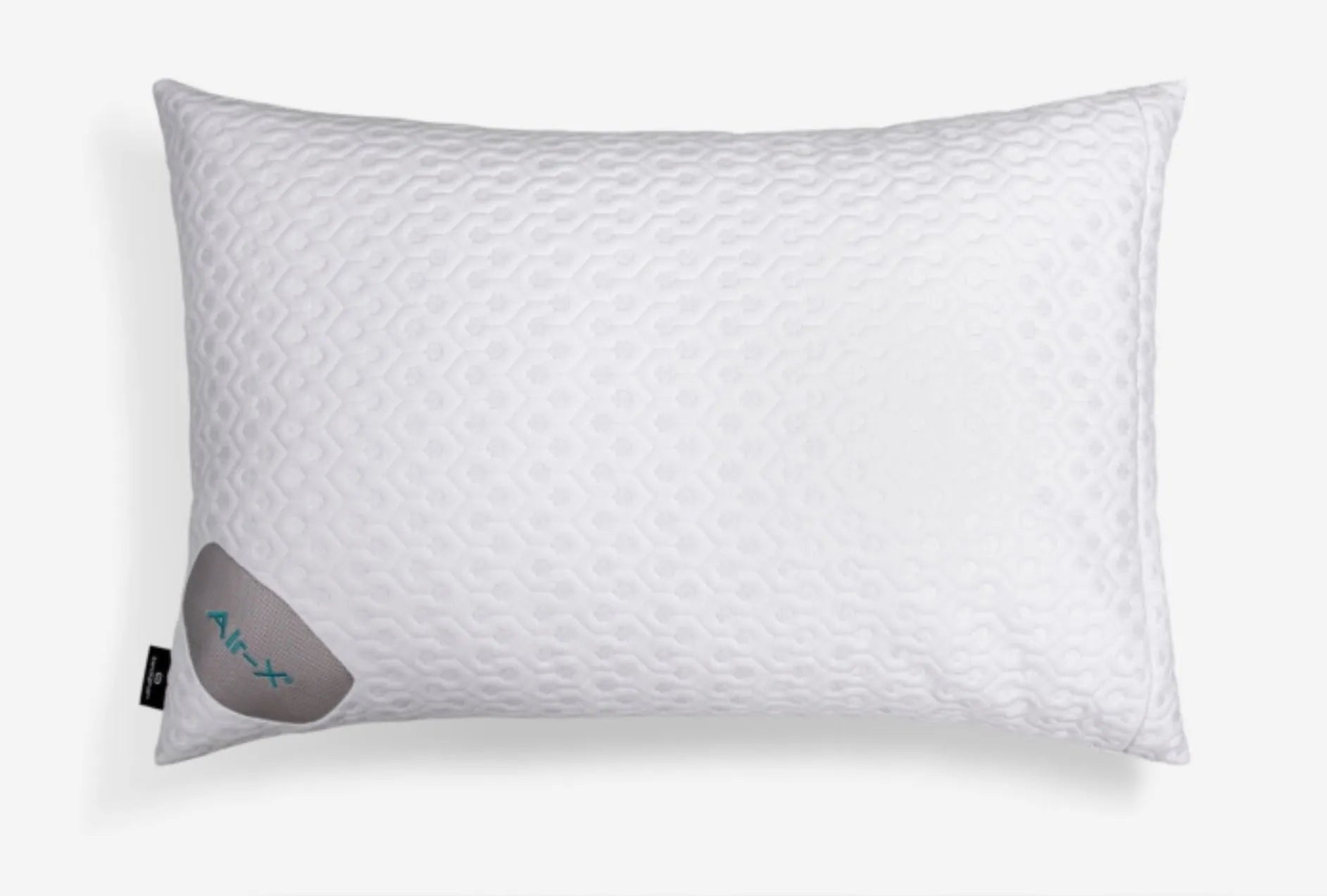 A white textured pillow with a subtle diamond pattern, featuring a gray fabric tag on the lower left corner with the brand name 'Air-X' in teal, set against a clean white background.