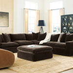 Modern living room with a brown sectional sofa and ottoman