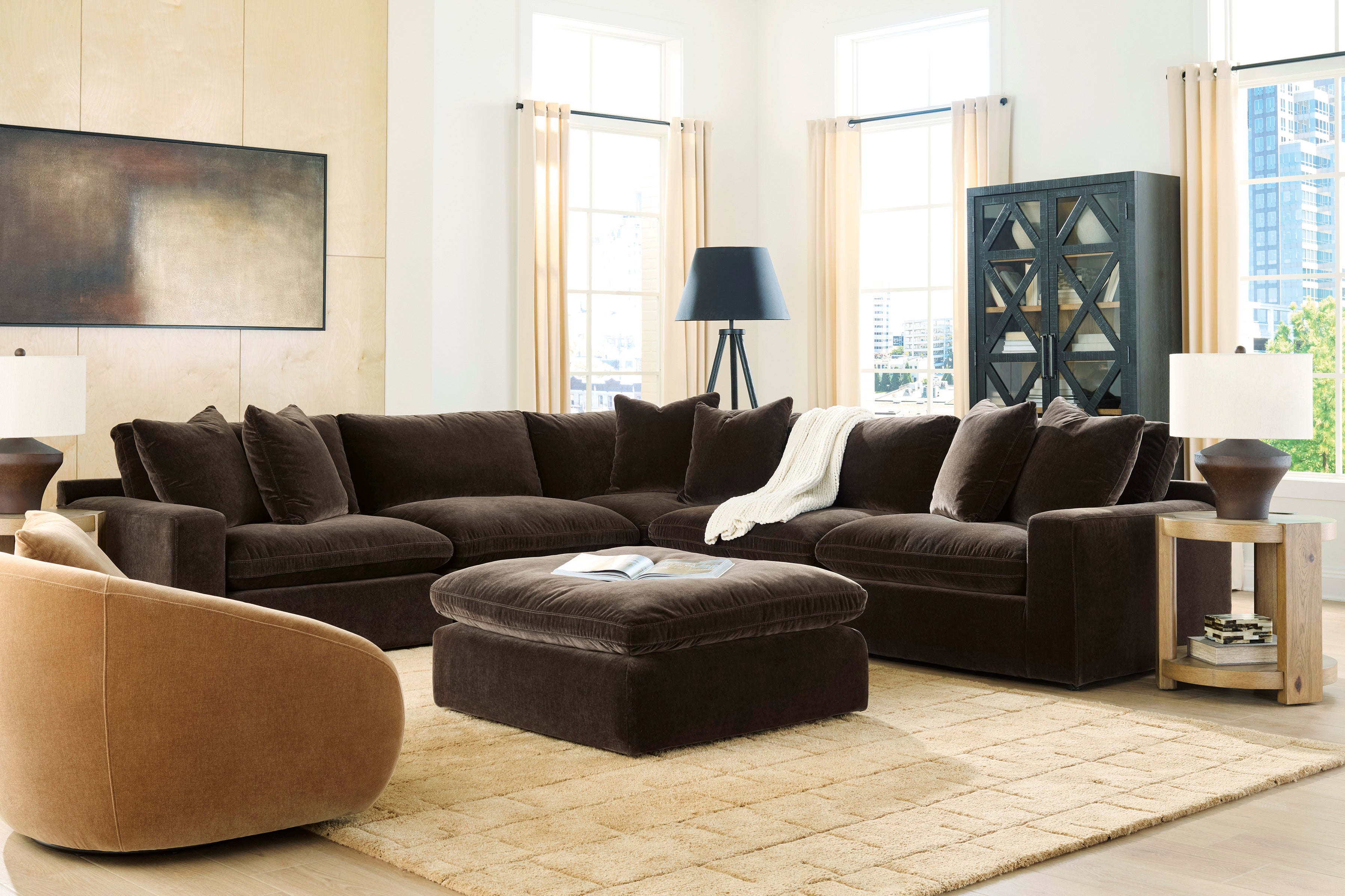 Modern living room with a brown sectional sofa and ottoman