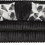 A black ribbed velvet loveseat sofa with two square throw pillows featuring a black, white, and gray geometric pattern, shown against a plain white background.