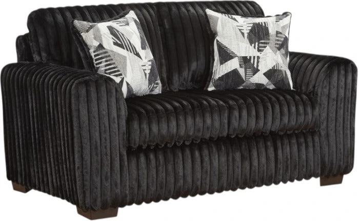 A black corduroy loveseat sofa with two black and white patterned accent pillows, shown against a plain white background.