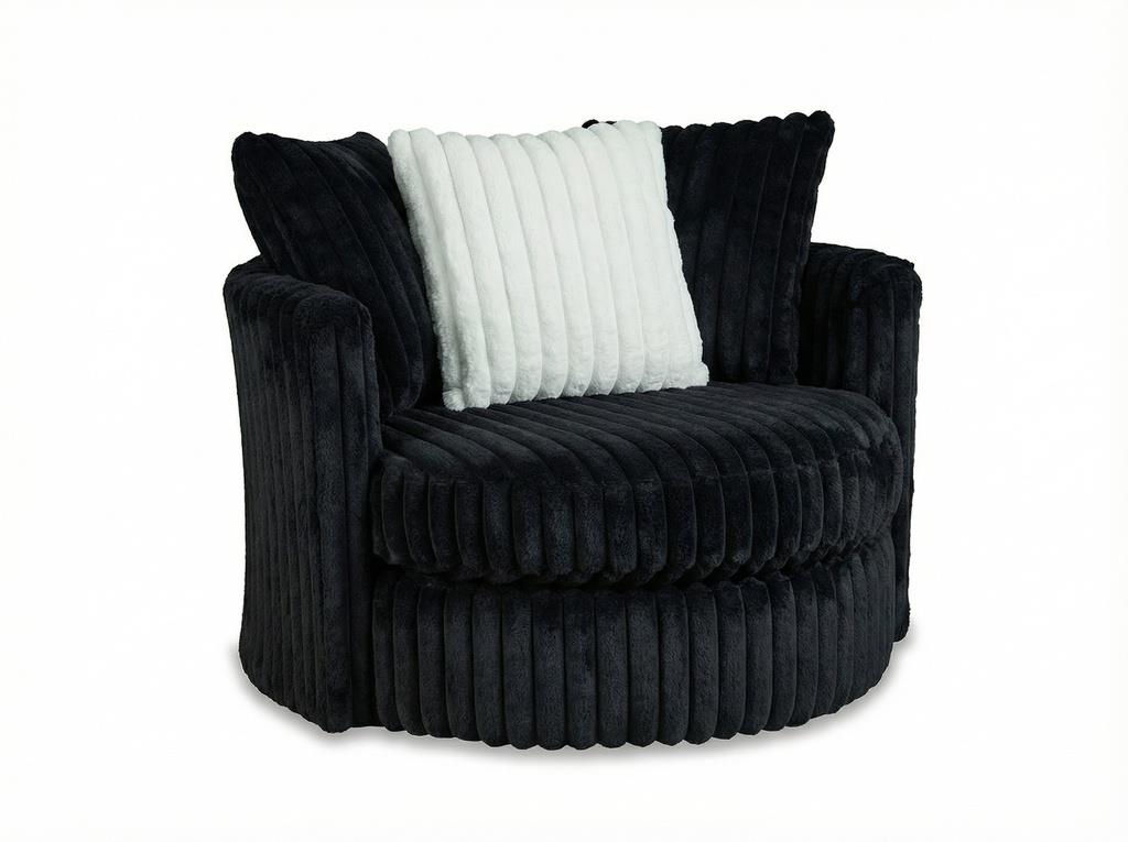 A modern barrel-style accent chair upholstered in a dark charcoal gray corduroy fabric, featuring a white ribbed throw pillow, set against a plain white background.