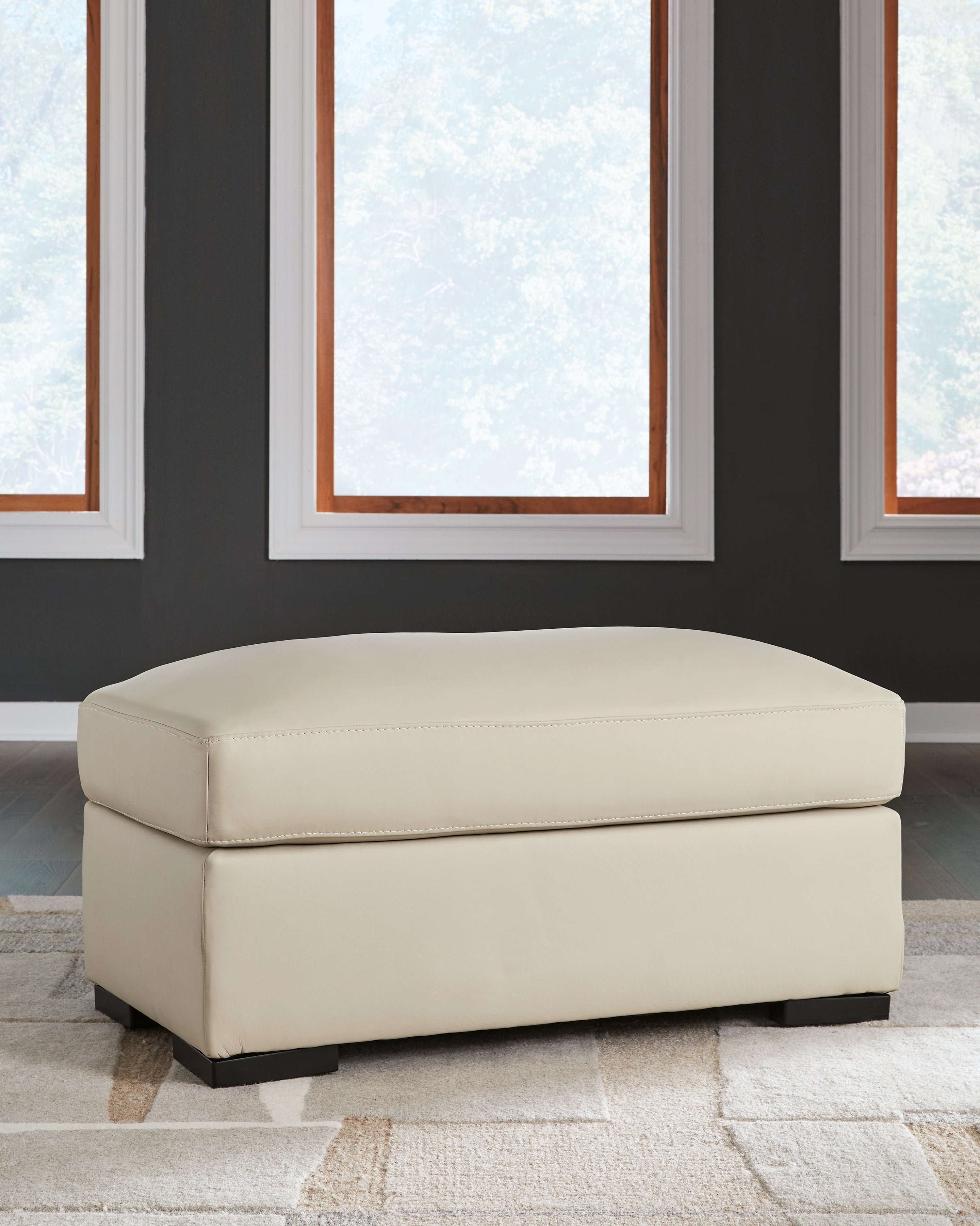 Ashley Furniture - TRESURE TROVE ALMOND OTTOMAN - White Leather Match - Ottomans - Additional View 1
