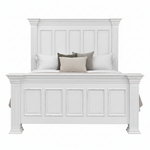 A white wooden bed frame with a tall paneled headboard and matching footboard, styled with white, gray, and beige pillows on a plain white background.