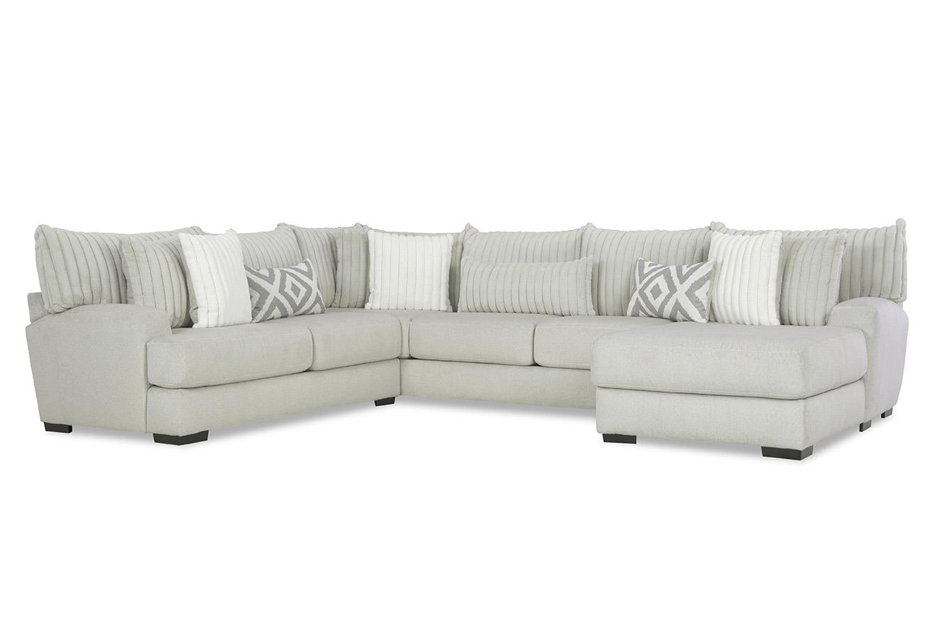 Gray sectional sofa with patterned cushions on a white background