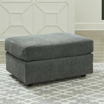 Ashley Furniture - STAIRATT GRAVEL OTTOMAN - Dark Gray Fabric - Ottomans - Additional View 1