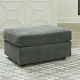 Ashley Furniture - STAIRATT GRAVEL OTTOMAN - Dark Gray Fabric - Ottomans - Additional View 1
