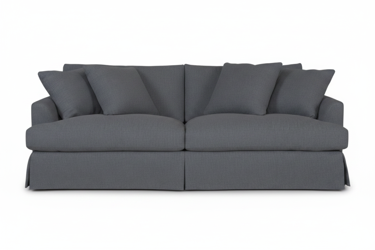 A dark gray fabric slipcovered loveseat sofa with matching back cushions and armrests, shown from a front-facing angle on a plain white background.