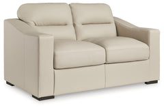 Ashley Furniture - TRESURE TROVE ALMOND LOVESEAT - White Leather Match - Loveseats