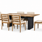 A 7-piece dining room set featuring a rectangular wooden table with a black metal pedestal base and six matching chairs with beige upholstered seats and backs, shown on a solid white background.