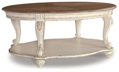 Ashley Furniture - REALYN OVAL COCKTAIL TABLE - Light Brown Wood - Tables