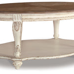 Ashley Furniture - REALYN OVAL COCKTAIL TABLE - Light Brown Wood - Tables