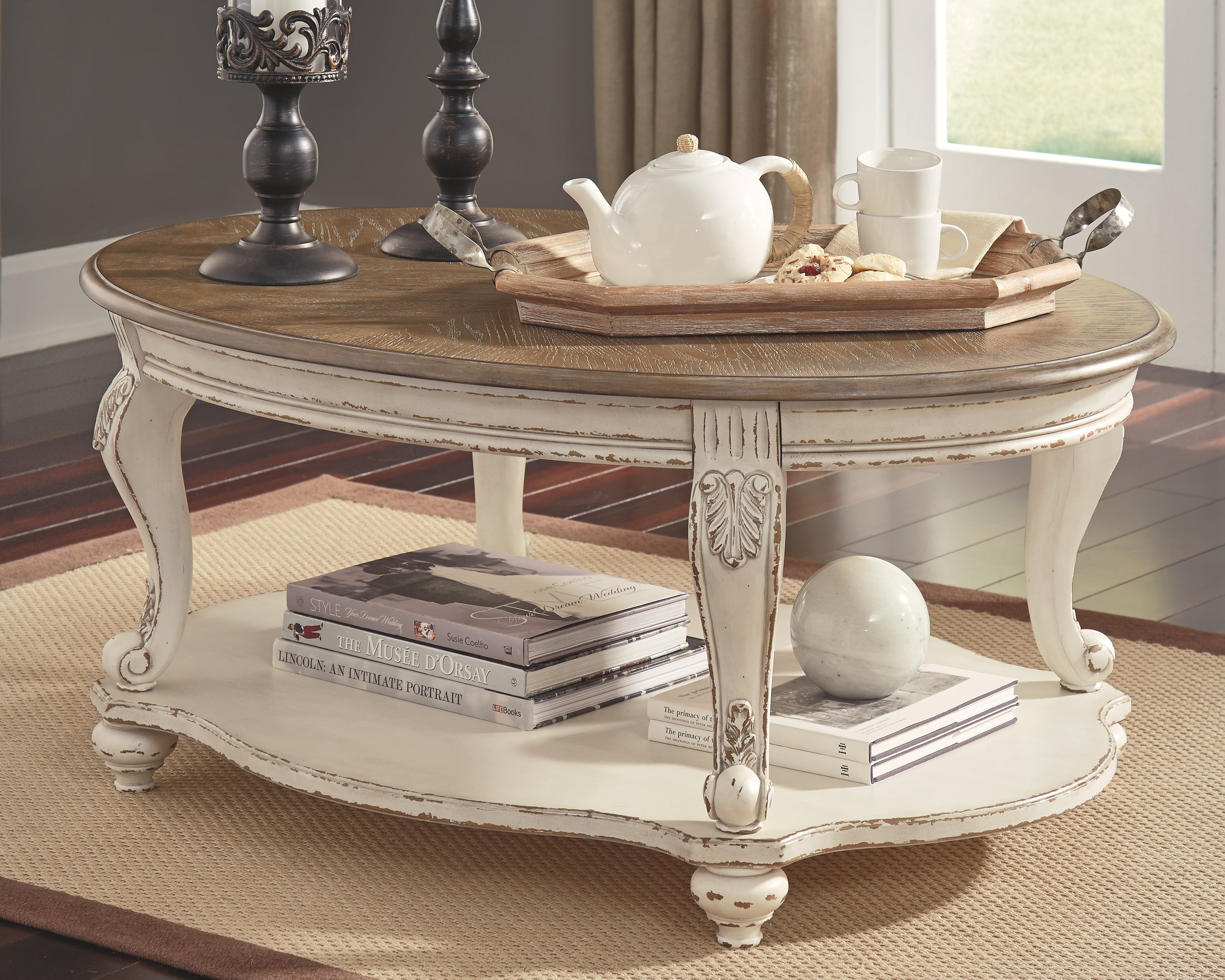 Ashley Furniture - REALYN OVAL COCKTAIL TABLE - Light Brown Wood - Tables - Additional View 1