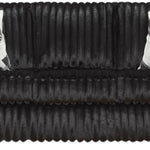 A black ribbed sofa with two black and white geometric patterned throw pillows, shown against a plain white background.
