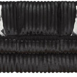 A black ribbed sofa with two black and white geometric patterned throw pillows, shown against a plain white background.