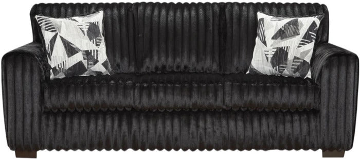 A black ribbed sofa with two black and white geometric patterned throw pillows, shown against a plain white background.