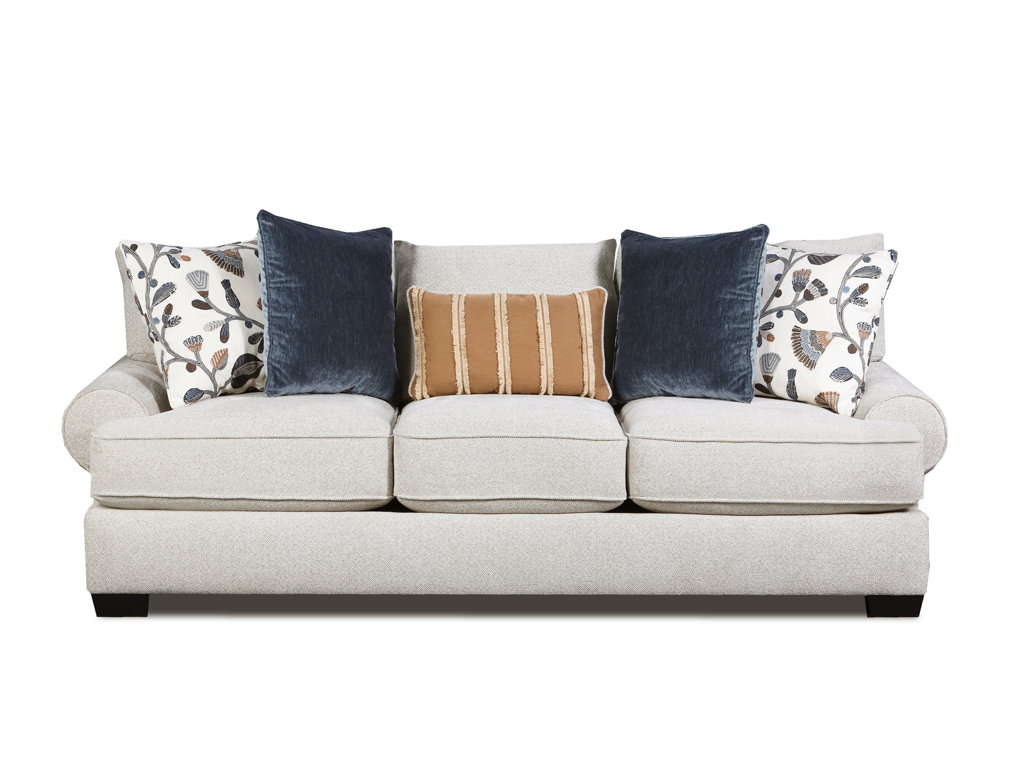A three-seat upholstered sofa in a light warm gray or off-white fabric, styled with five decorative throw pillows including two navy blue velvet pillows, two patterned white pillows, and one tan striped pillow, shown against a plain white background.