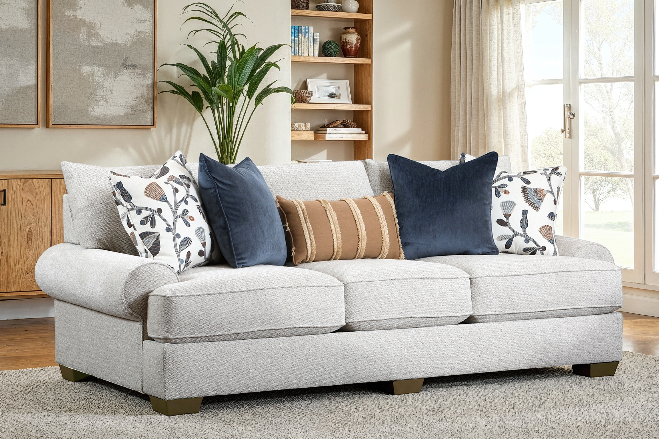 Gray sofa with decorative pillows in a living room setting