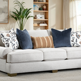 Gray sofa with decorative pillows in a living room setting