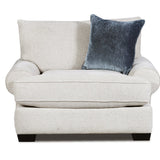 A light beige upholstered armchair with a dark blue textured throw pillow, shown against a plain white background.