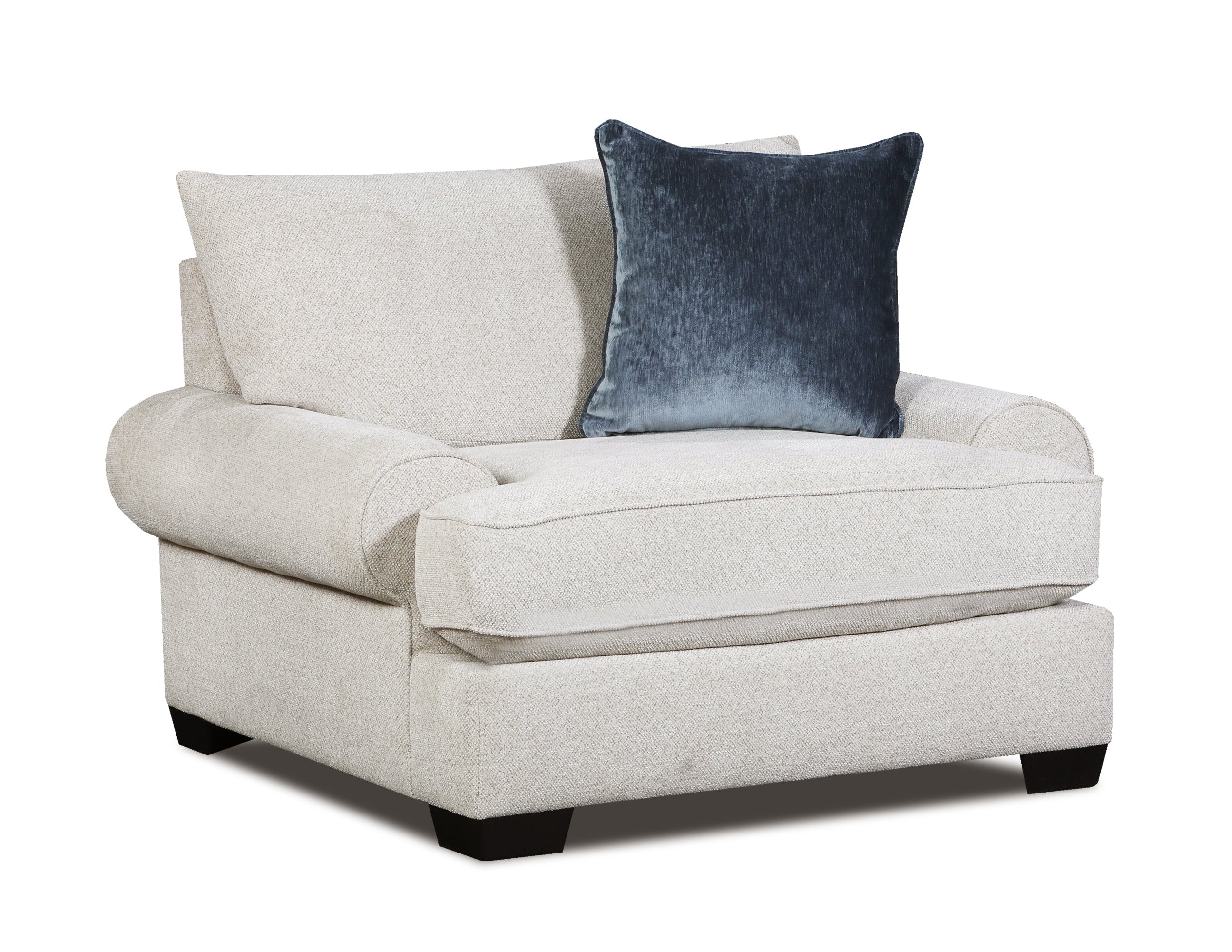 A light beige upholstered armchair with a dark blue velvet accent pillow, shown on a plain white background.