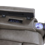 Gray recliner chair with volume control panel and cup holder on a white background