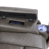 Gray recliner chair with volume control panel and cup holder on a white background