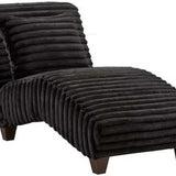 Black ribbed chaise lounge chair on a white background