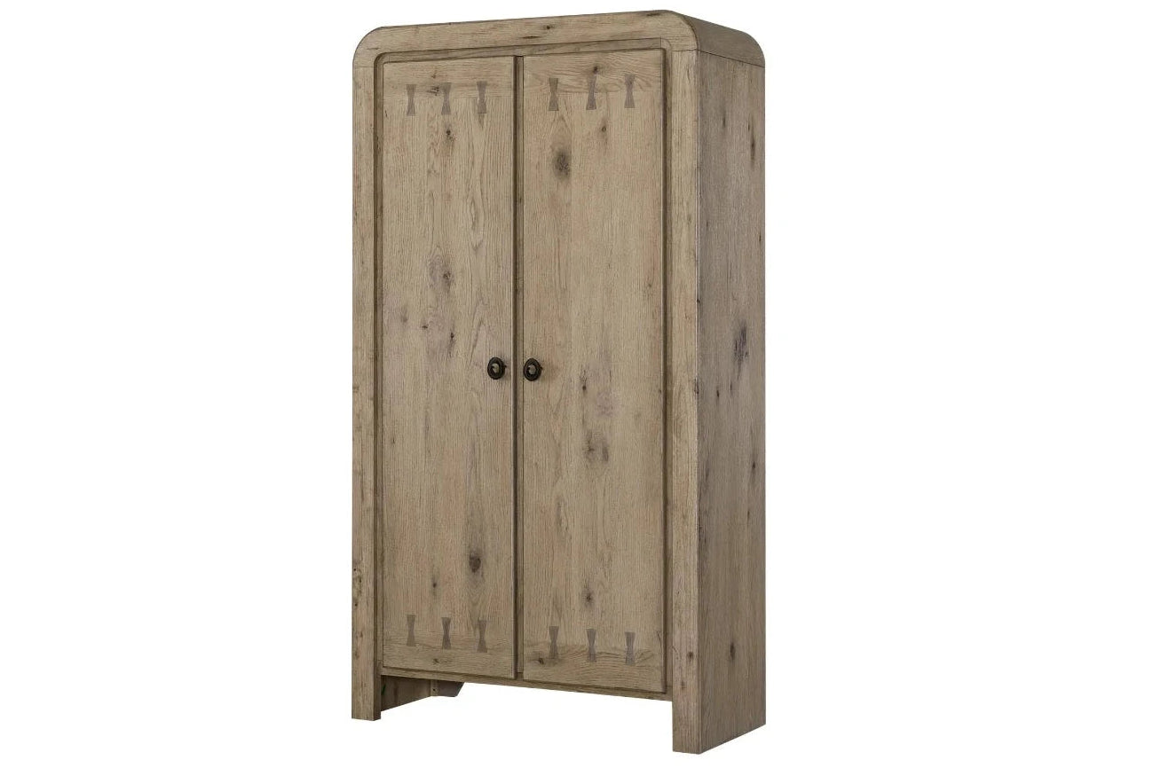 A rustic two-door wooden cabinet with a weathered light brown finish and small round black knobs, shown against a plain white background.