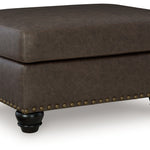 Ashley Furniture - ROXMERE UMBER OTTOMAN - Dark Brown Faux Leather - Ottomans