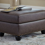 Ashley Furniture - ROXMERE UMBER OTTOMAN - Dark Brown Faux Leather - Ottomans - Additional View 1