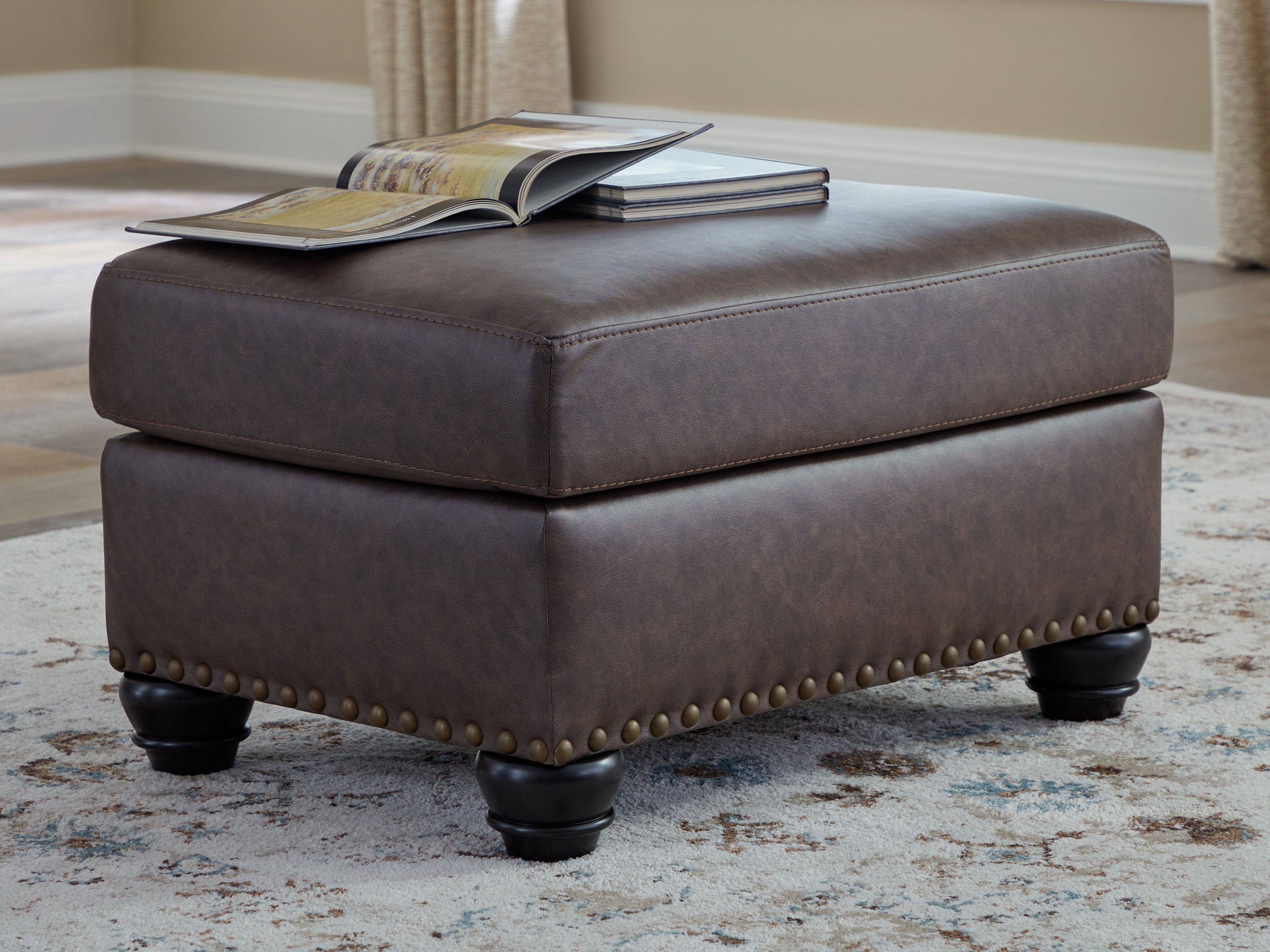 Ashley Furniture - ROXMERE UMBER OTTOMAN - Dark Brown Faux Leather - Ottomans - Additional View 1