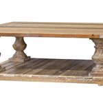 Wooden coffee table with decorative legs on a white background