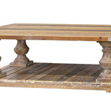 Wooden coffee table with decorative legs on a white background