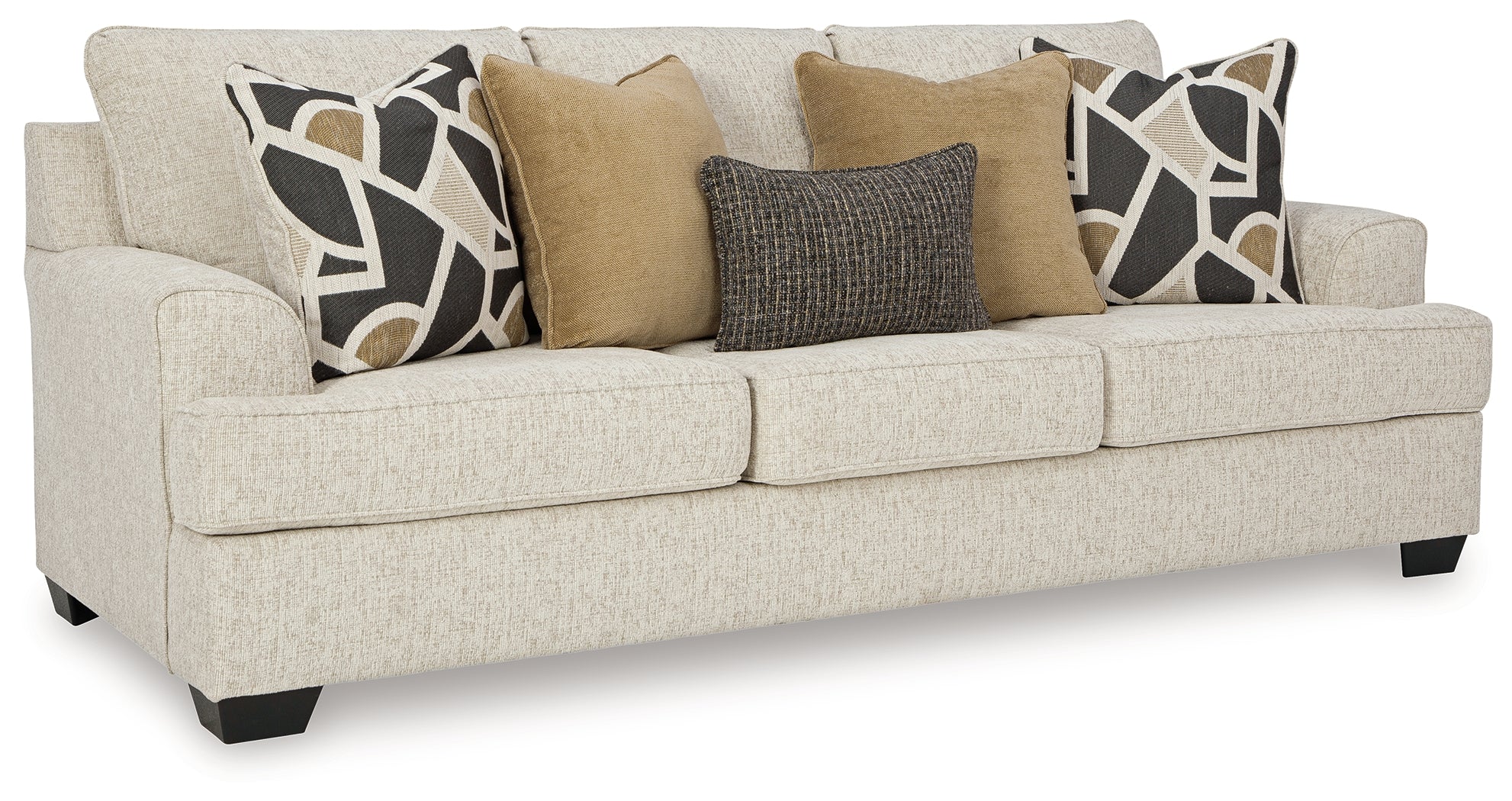Living room with a beige sofa, decorative pillows, and two lamps.