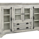 A distressed white wood sideboard cabinet with glass-front upper doors, open shelves, and three drawers with dark metal pulls, shown on a plain white background.