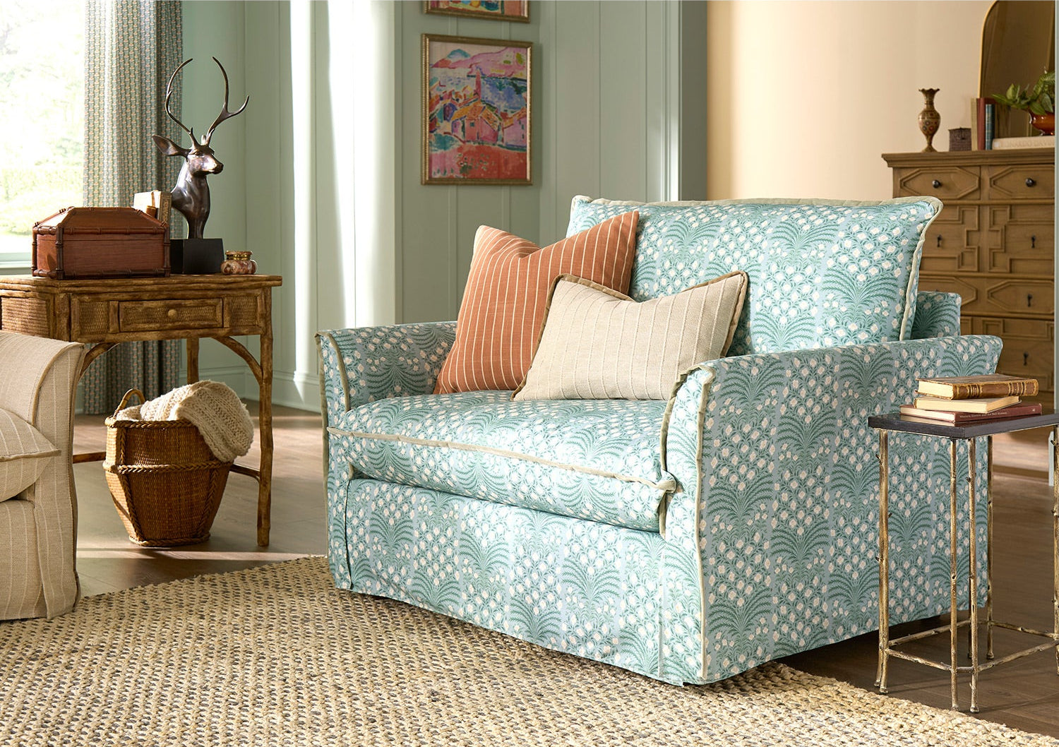 Patterned sofa with decorative pillows in a living room setting