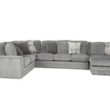 A light gray fabric sectional sofa with a left-facing chaise lounge and multiple decorative throw pillows, shown against a plain white background.