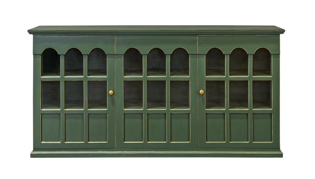 A green wooden cabinet with six glass-paneled doors arranged in three pairs of three arched windows each, featuring small brass knobs, shown against a plain white background.
