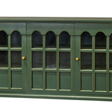 A green wooden sideboard cabinet with three glass-paneled doors and small gold knobs, shown against a plain white background.