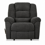 A dark gray upholstered recliner chair with padded backrest, armrests, and a footrest, shown against a plain white background.