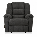 A dark gray upholstered recliner chair with padded backrest, armrests, and a footrest, shown against a plain white background.