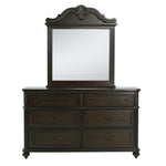 A dark brown wooden dresser with six drawers and an attached rectangular mirror featuring an ornate carved top frame, shown against a plain white background.