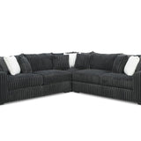 Black sectional sofa with white cushions on a white background