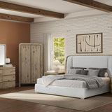 Modern bedroom with a bed, dresser, and wardrobe in a well-lit room.
